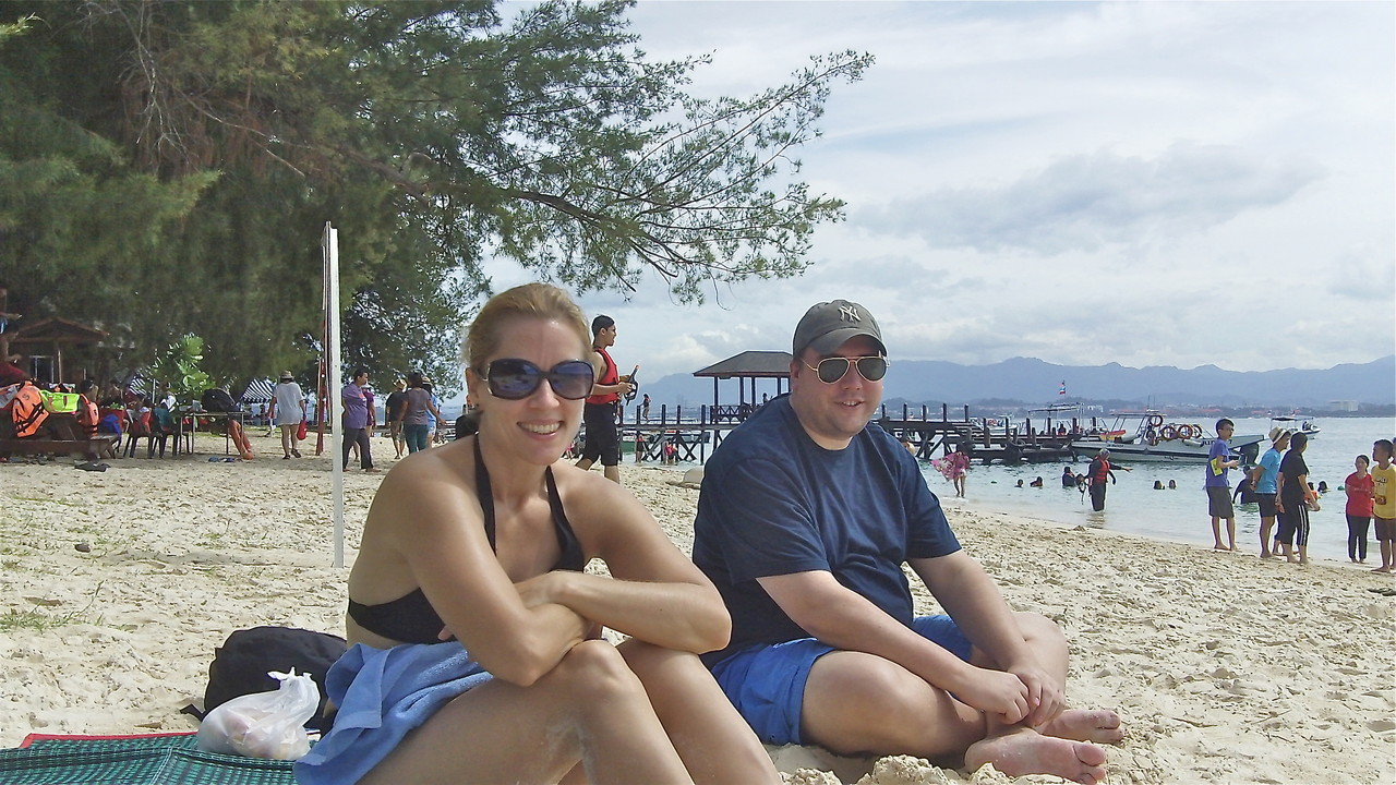 Emily & Greg relax on the beach.