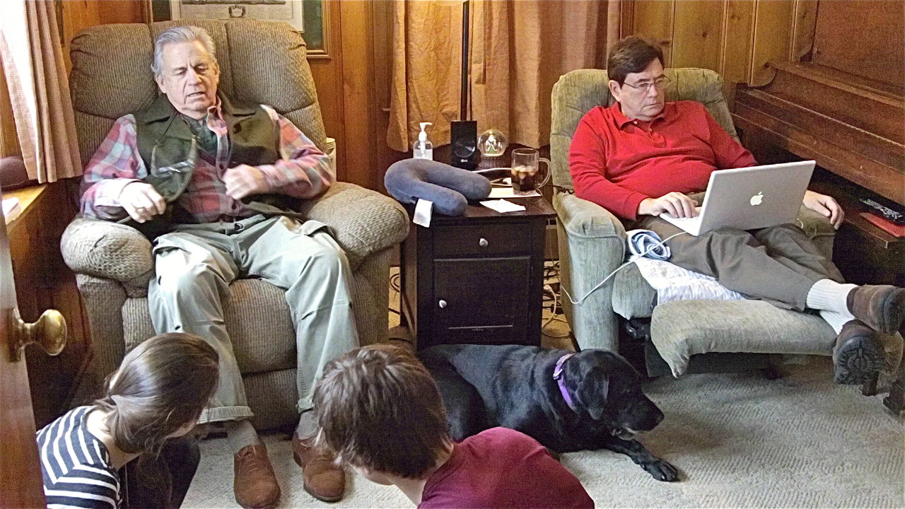 Stuart and John relax in the den in Syracuse, NY