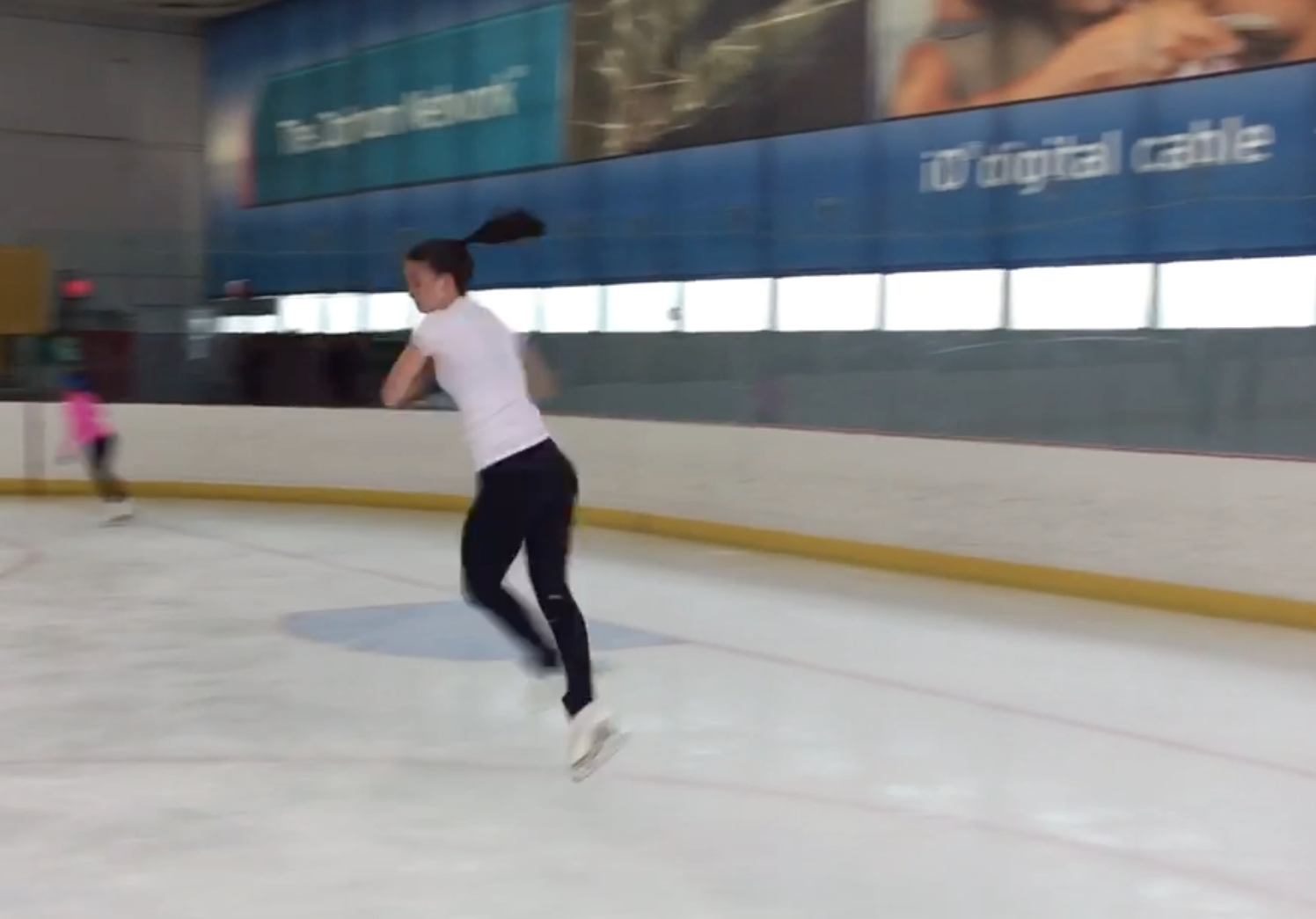 Ellie doing a double jump at the skating rink. May, 2017.