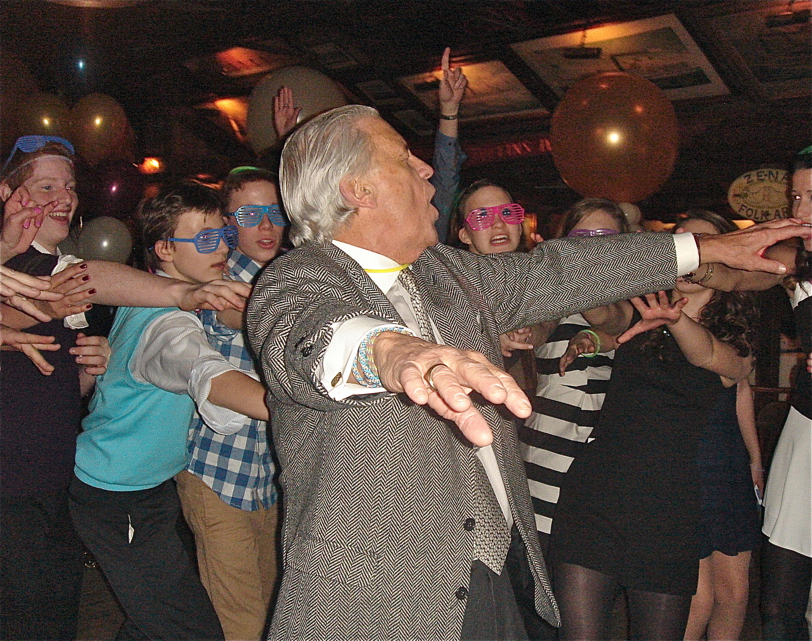 Stuart Sr. shows off his moves on the floor, his son Jack in blue vest in bkground