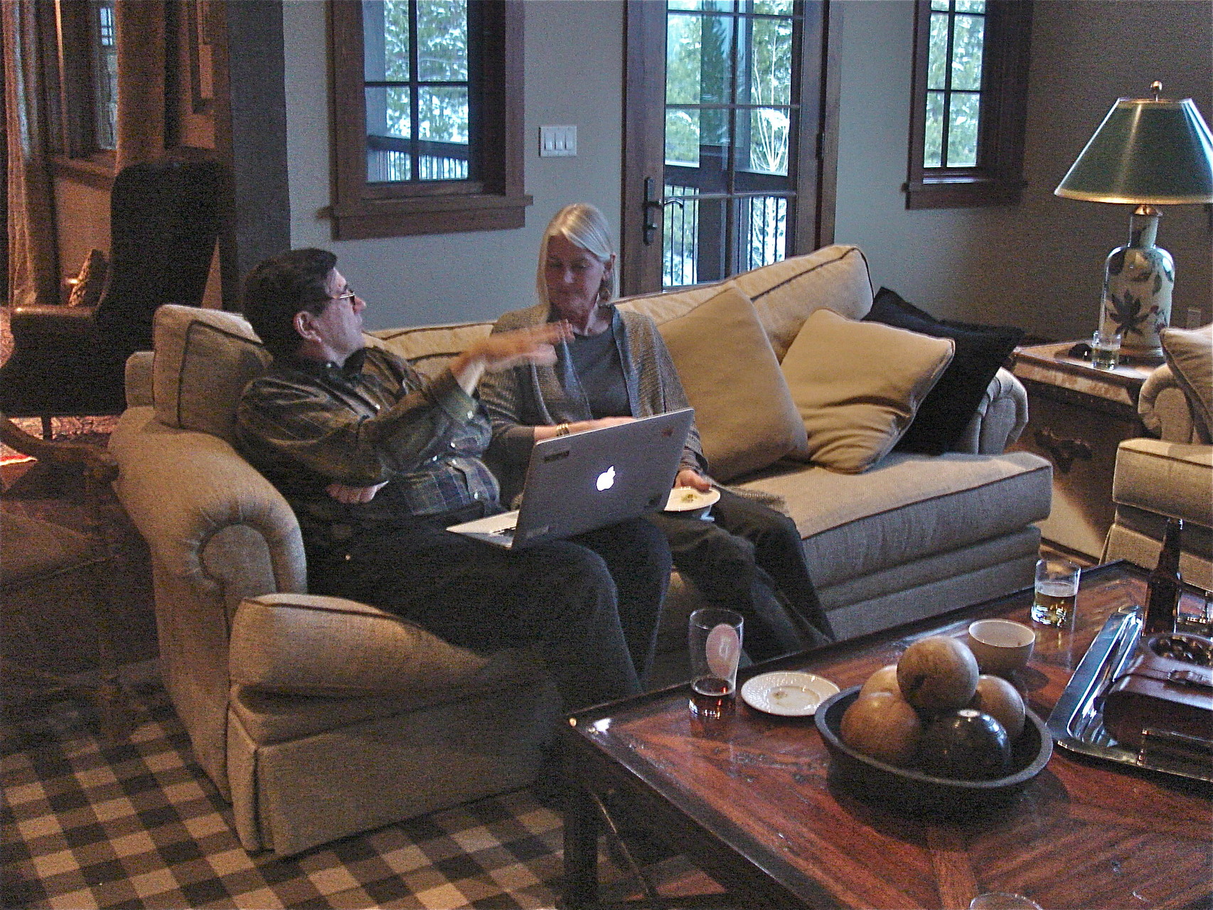 John and his cousin Kathy Schmidt talk before dinner at Big Sky, 3-2015