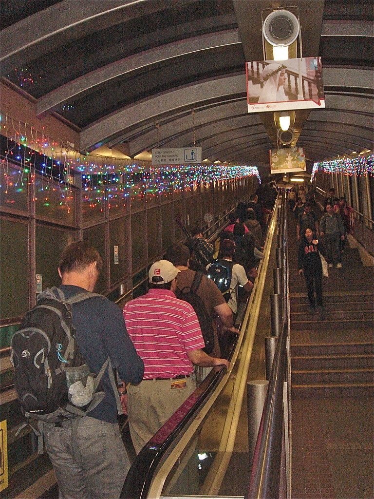 Greg & John take the escalators-longest outdoor escalators in the world