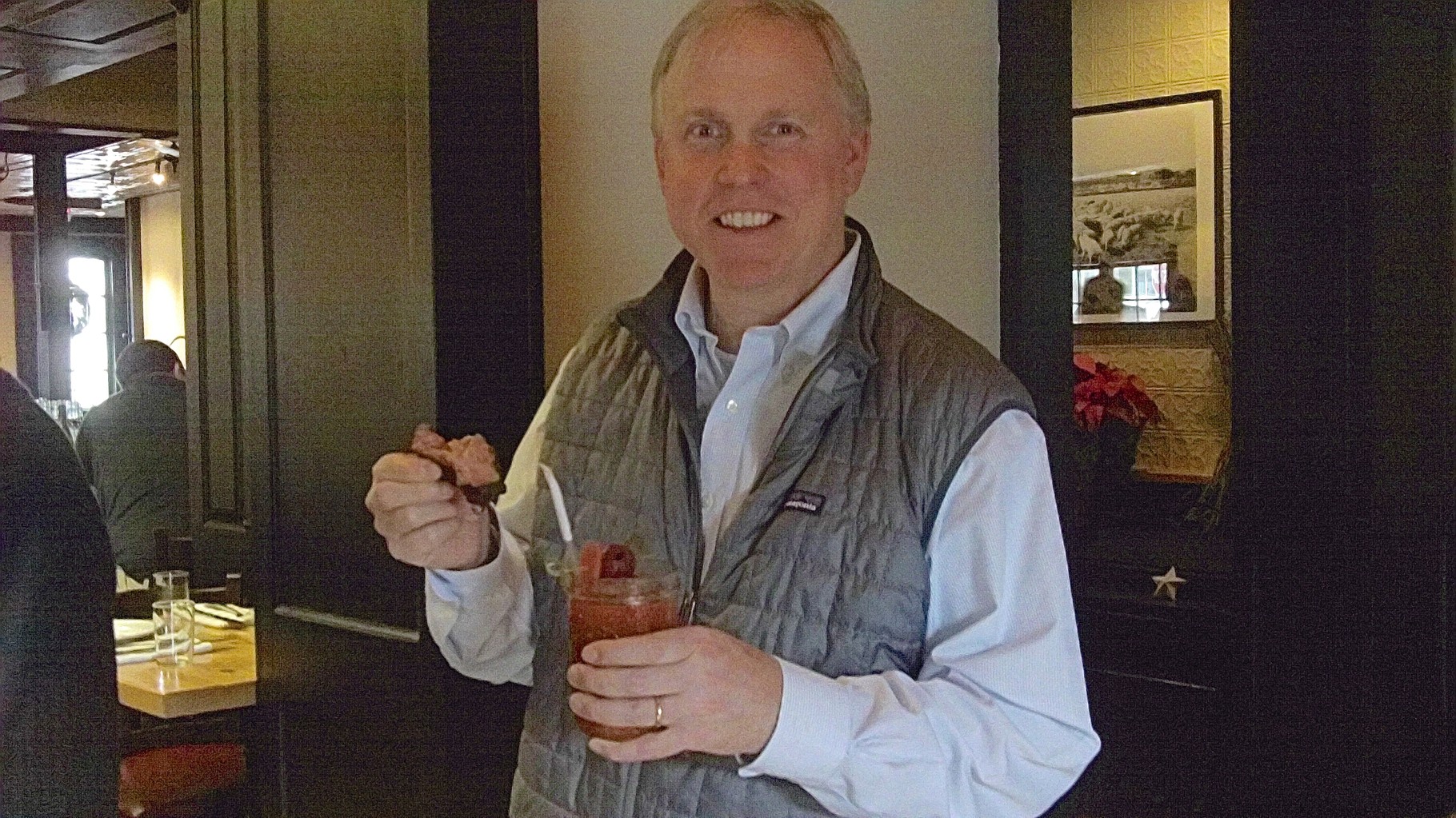 Stuart Jr. with rib and bloody mary at Celeste's party