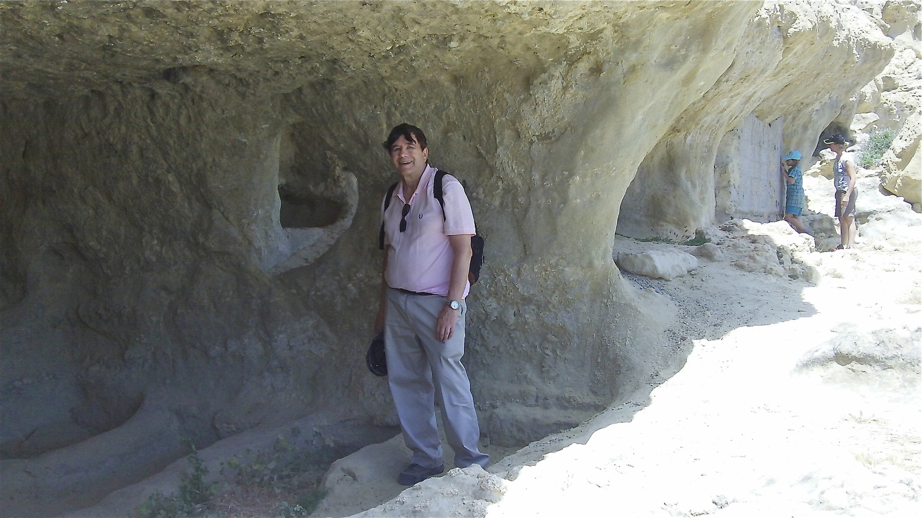 John on the Matala cliffs and caves; you can see the Roman grave sites delineated in the cave.