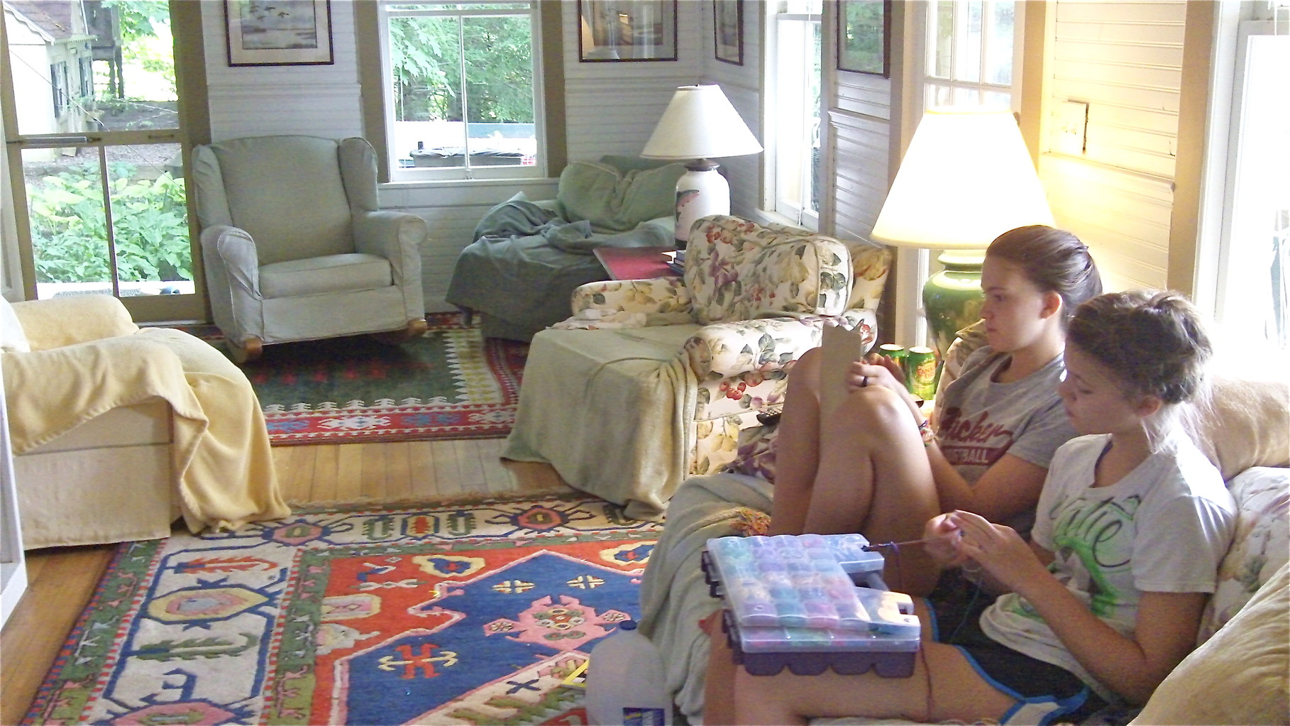 The girls make bracelets on a rainy day in July, 2014, at the lakehouse.