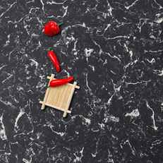 red pepper on black engineered quartz countertop