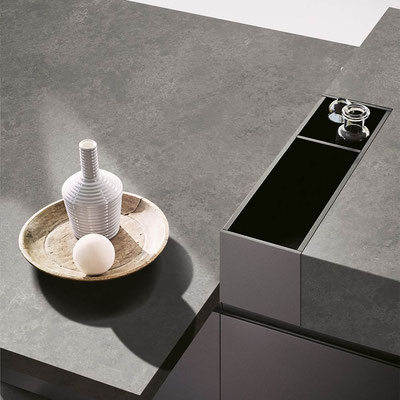 Two-leveled kitchen island from Sodostone Volcanic Grey quartz