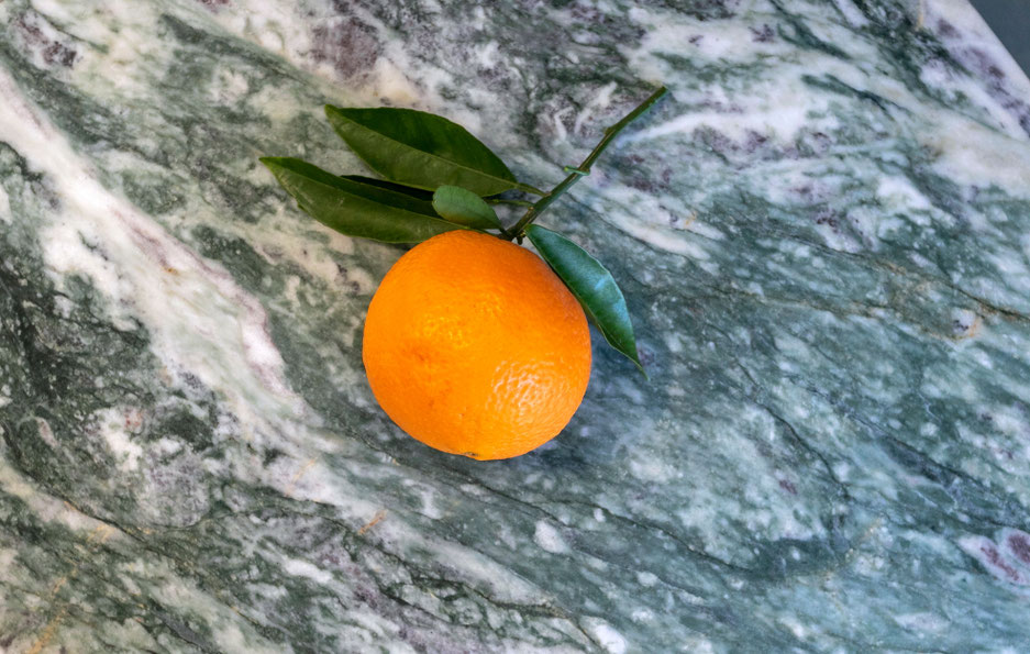 green and white granite table with purple dots