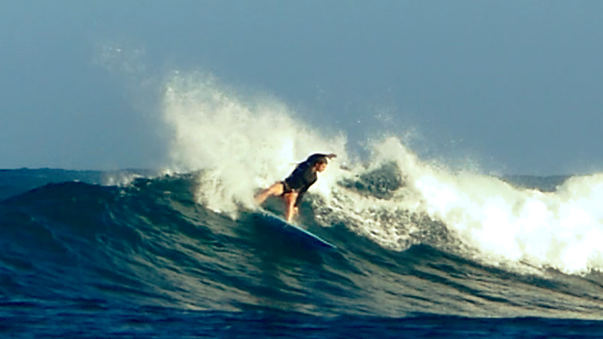 Driving the right arm through the turning sequence, through the torso into legs, feet to board.