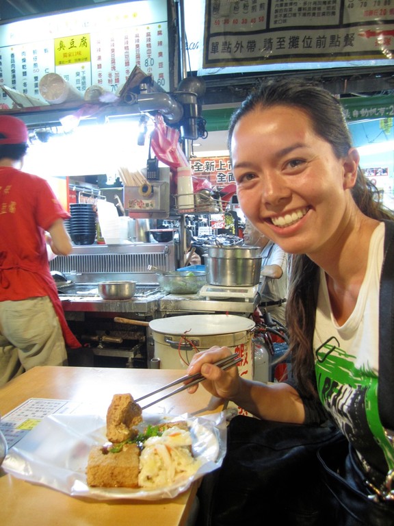 Me enjoying not-very-stinky stinky tofu at RaoHe night market