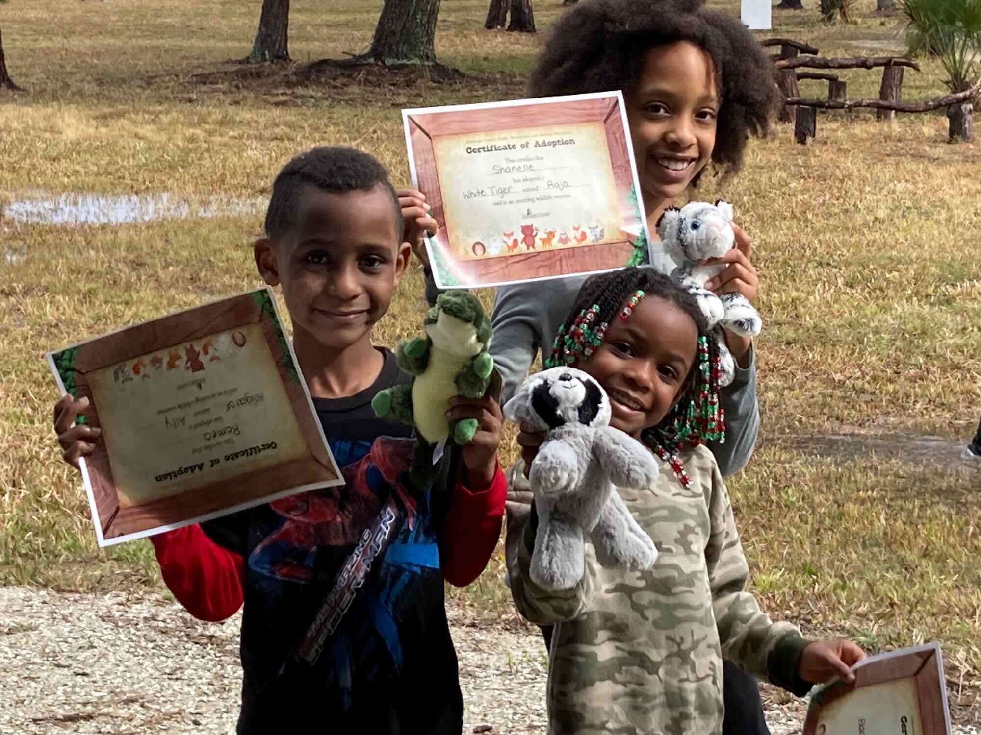 Cub Crawl kids with certificates and stuffed animals