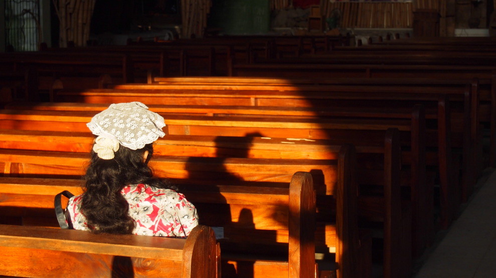 Praying Philippina, Camiguin, Philippines
