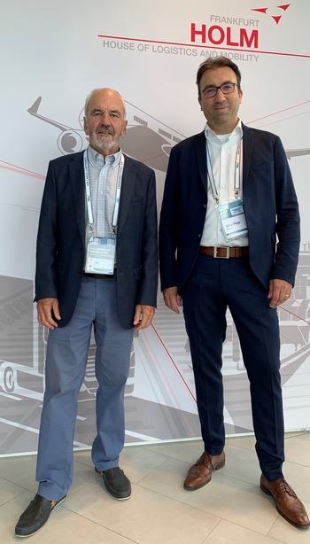 Peter Somaglia of CarbonCare (standing left) and Riege Software manager Tobias Riege announced a close cooperation in environmental issues  -  courtesy: Riege Software