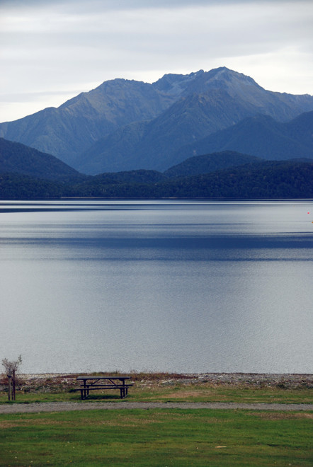 The dead flat waters and light of Lake Te Anau at midday in late summer.