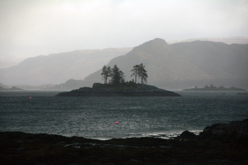 The rain and wind draining colour from the day: one of the many islands scattered in the narrows of Loch Carron from Plockton/Am Ploc