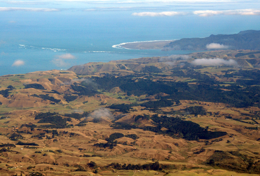 The Manukau Entrance and Whatipu from the air with the extensive sandhills of the coast south of Manukau in the foreground.