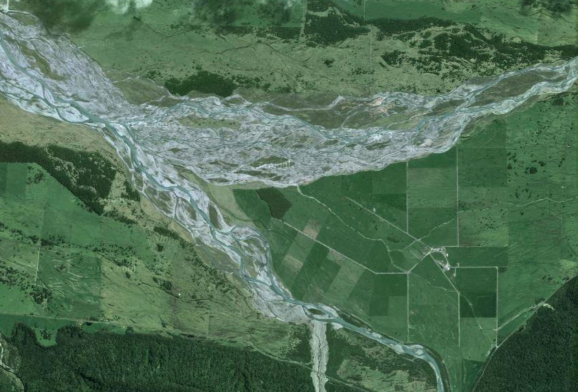 The confluence of the Fox (top) and Balfour (bottom) braided rivers on the coastal plain below the glacial valley showing previous riverbed courses  (NZ Top/Google)