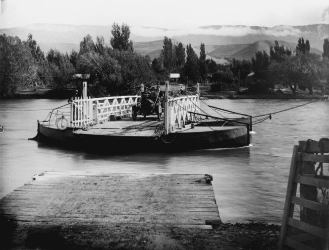 Before bridges were built the river was crossed by ‘punts’ . This is Lowburn punt  photographed by J Ingley in 1901 Ref: MNZ-1738-1/2-F. Alexander Turnbull Library, Wellington, New Zealand