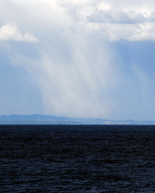 Snow falling out of the storm clouds over the Karpasia and the wine-dark sea