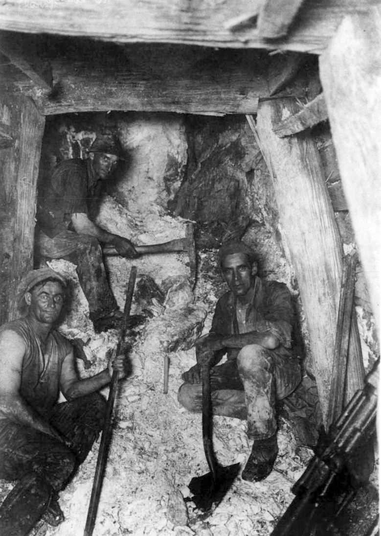 Goldminers (T. Beckworth, L. Williams and R. Hogg) underground at Waiuta in the 1930s taken by Joe Divis. 