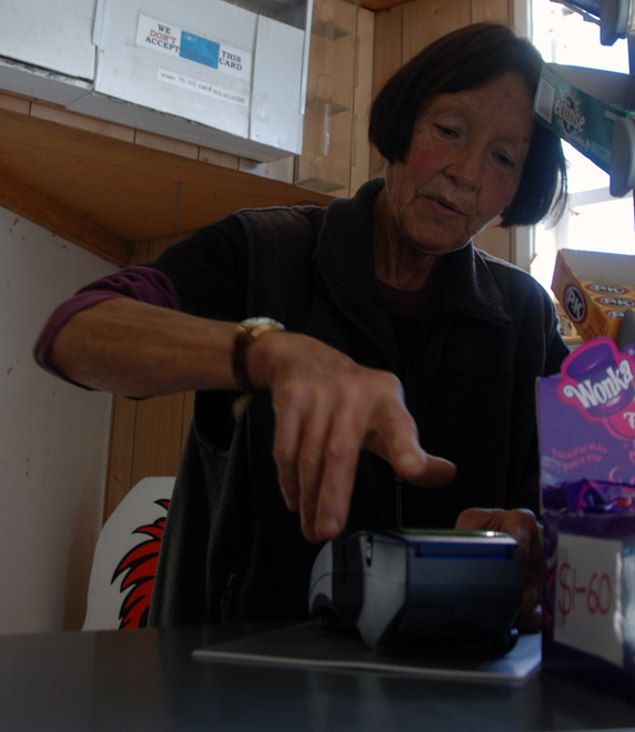 The woman in the filling station in Whataroa.