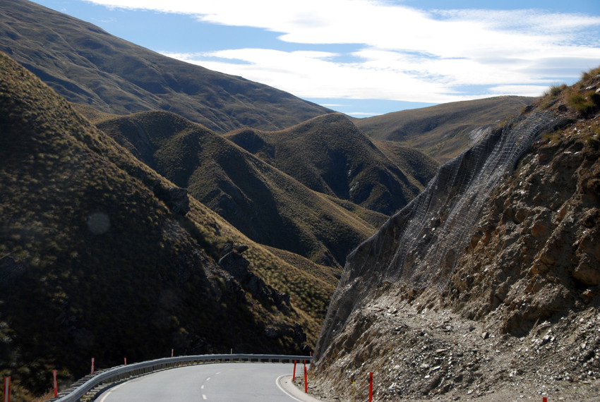 The southern end of the Cardrona Valley and the steep descent to the valley bottom through the tussock hills.