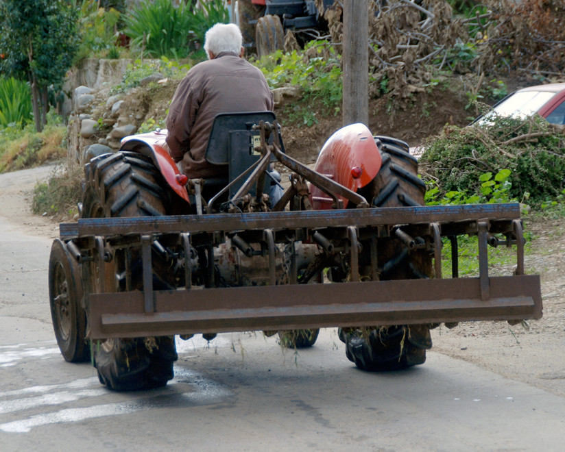 Tractor dripping wet from fording the Peristona River. 