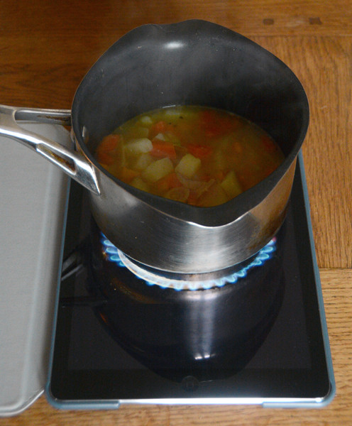  iQook App:  iPad being used as cooker, stove, hotplate, gasring to heat soup.