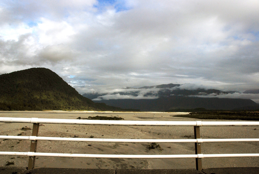 The long, single carriageway bridge over the Haast River near its mouth.