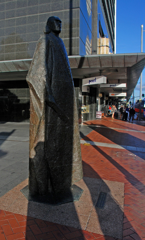 Bronze sculpture of 'A Maori Figure in a Kaitaka Cloak' (1964) by Molly Macalister at the confluence of Queen Street and the waterfront in Auckland's CBD. Click photo for Macalister biography.