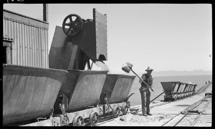 Picking up the spill at Golden Bay Cement Works (1939). The company ran from 1908 to 1988 supplying cement for the Manopuri Hydro scheme and the Clyde Dam (Click for credits).