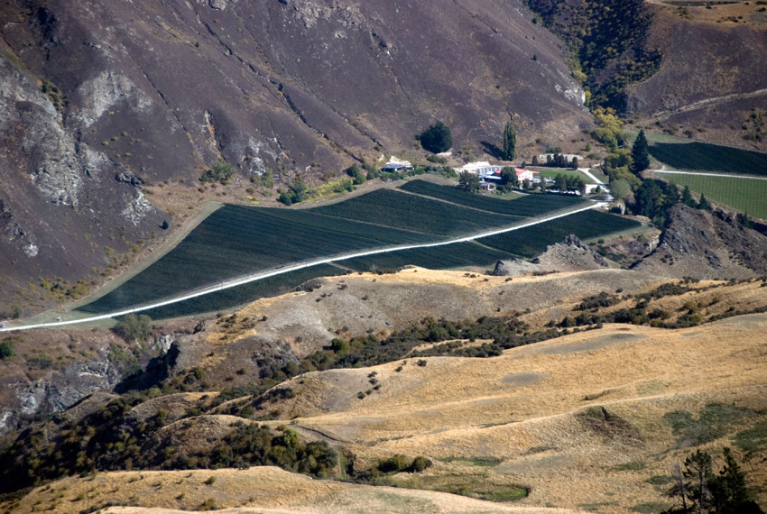 A winery in the Gibbston wine subregion of Central Otago from the Crown Range. Gibbston is the coolest and highest of the Central Otago sub-regions with vineyards between 320 and 420m altitude.