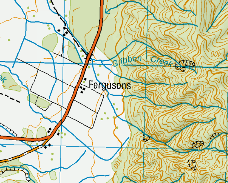 Fergusons Farm with its enclosed fields marked out on the flat land at the base of the Rangitoto Range