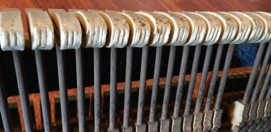 worn hammerheads of Upright piano