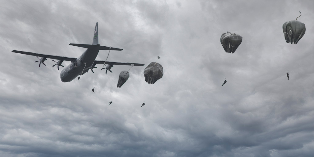 Fallschirmspringer springen beim D-Day-.Festival in der Normandie ab.