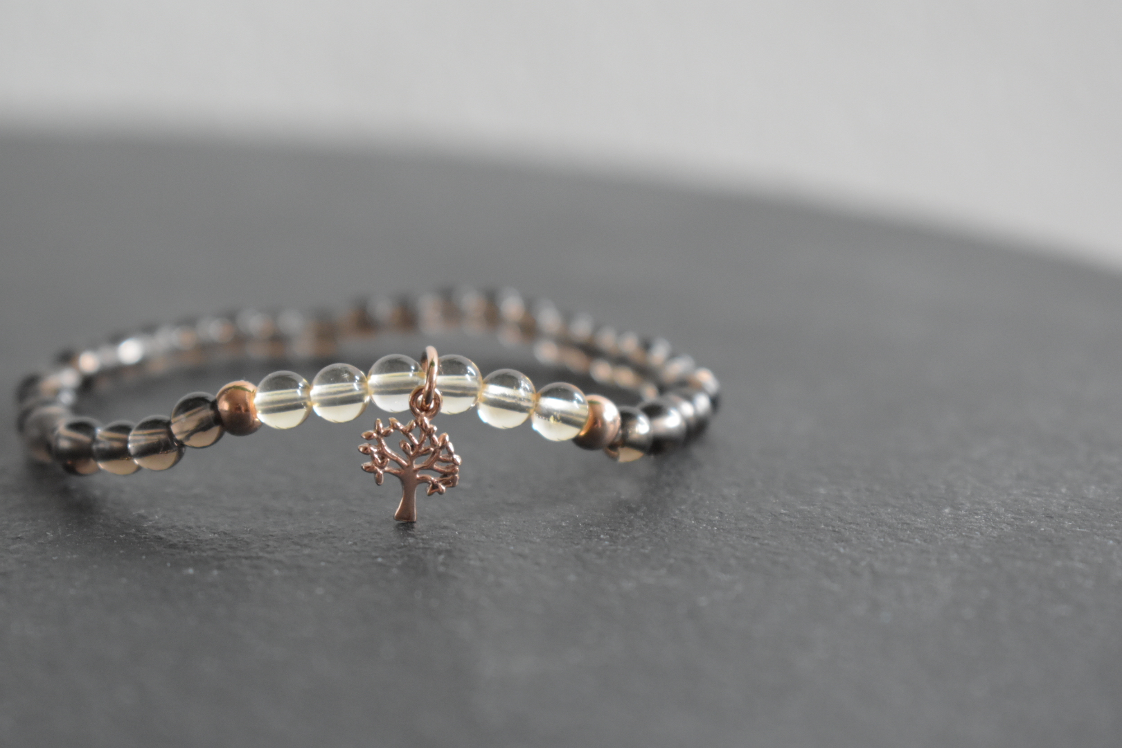 Refreshing combination of smoky quartz and citrine with rose-gold coated tree charm