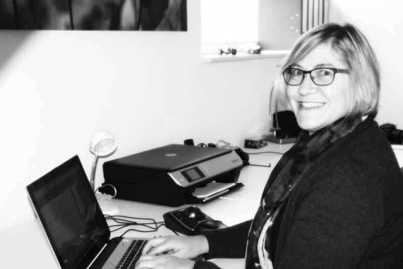 Angela Eldering working at her desk