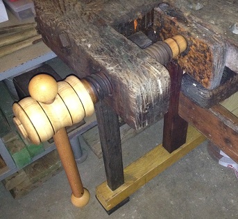 Shoulder vise on an old work bench.