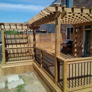 Soak up the sun and enjoy the shade with an expansive platform deck framed with an open-air pergola. Achieve a modern city vibe by accenting the rustic wood frame with trendy wrought iron rails. 