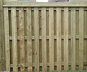 Surround your yard with beauty and privacy with this simple 6-foot wooden fence. Build in extra strength between the overlapping boards by adding 2x4 cross boards at the top, bottom and middle. 