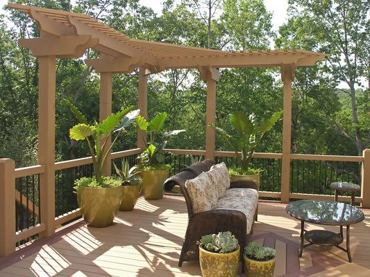 An L-shaped pergola is just the decorative element you need to spice up an ordinary deck. This open-air retreat is the perfect place to sit back and watch the sun set or enjoy an afternoon with friends. 