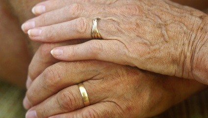 old hands with wedding rings