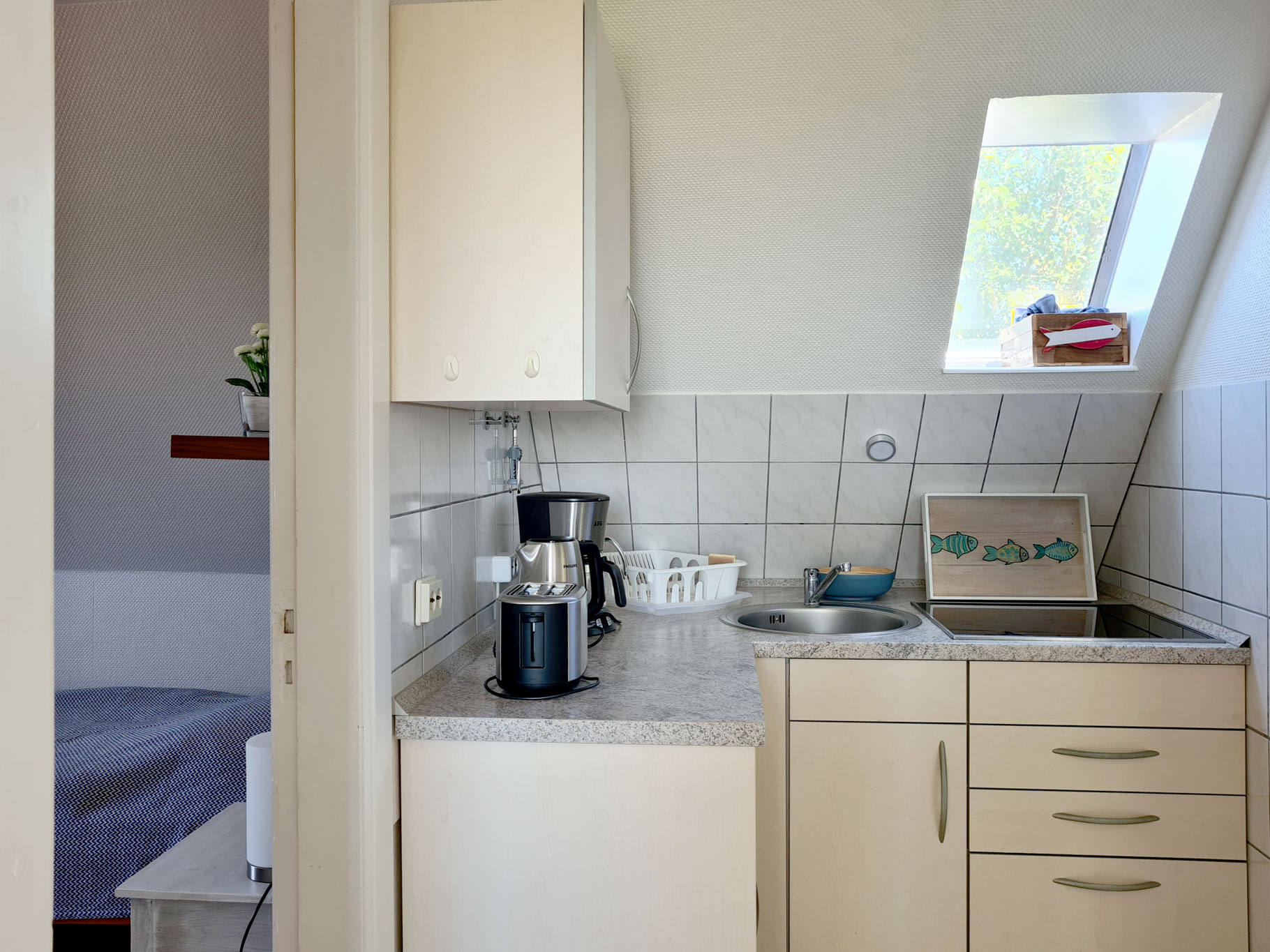Die gut ausgestattete Küche neben dem Zweibettzimmer 