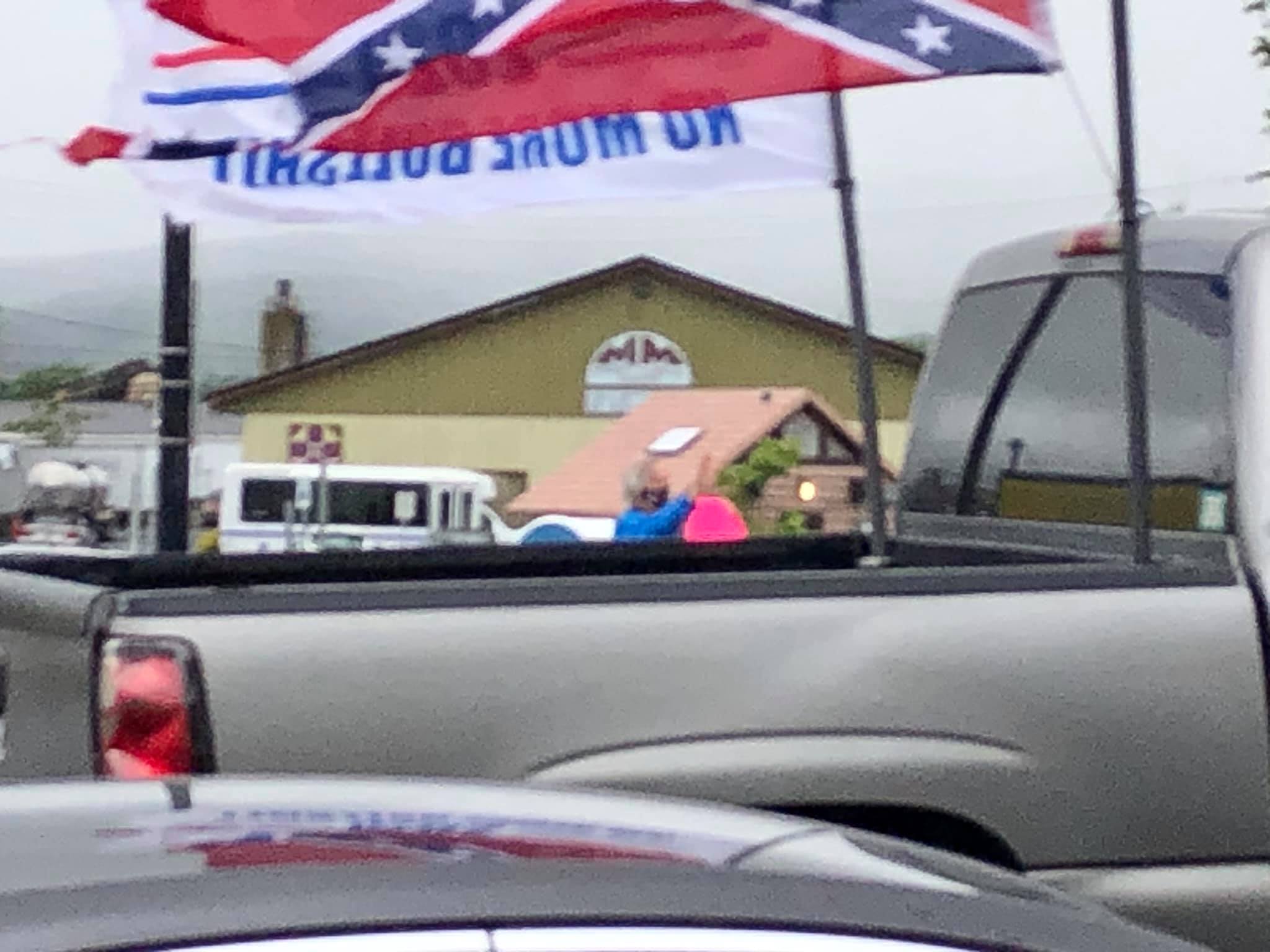 This pickup ostentatiously drove thru the rally sporting a confederate flag. I was not fast enough on the draw with the camera to catch all of it. 