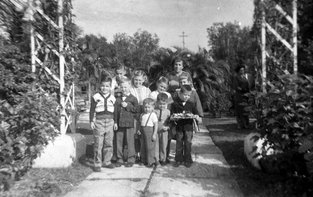 Raissa Kogevin with Russian children near St. Vladimir Church. Miami, 1958.
