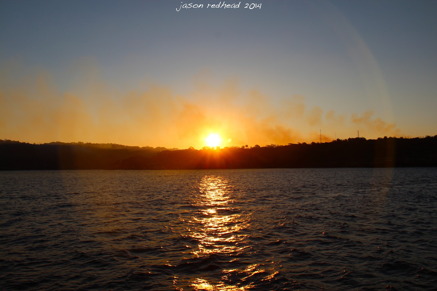  06-07-14 unkown cause; either the back burning continues or some idiot lit a fire near middle head. whatever the cause it has created a stunning sunset tonight, middle head, nsw 