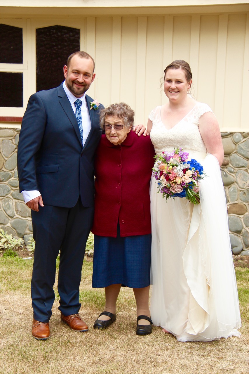 The happy couple tower over nana. Super STOKED for nana to be there today