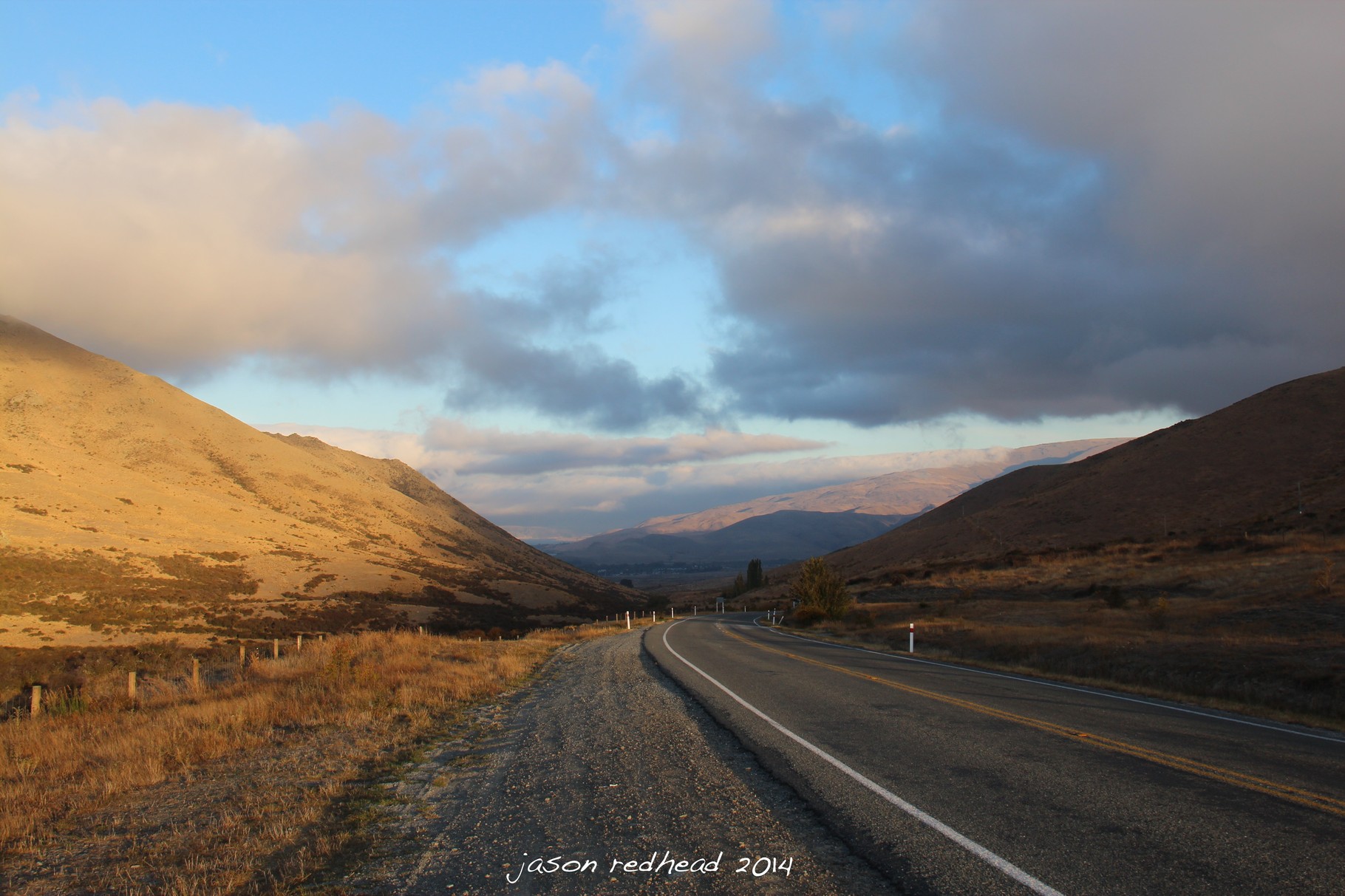  10-03-14 what's around the corner; a quick shot at the top of the hill before i freeze as the storm starts to blow through the valley. hurry up and get back in the car before a truck come and i get stuck behind it, otematata, nz 