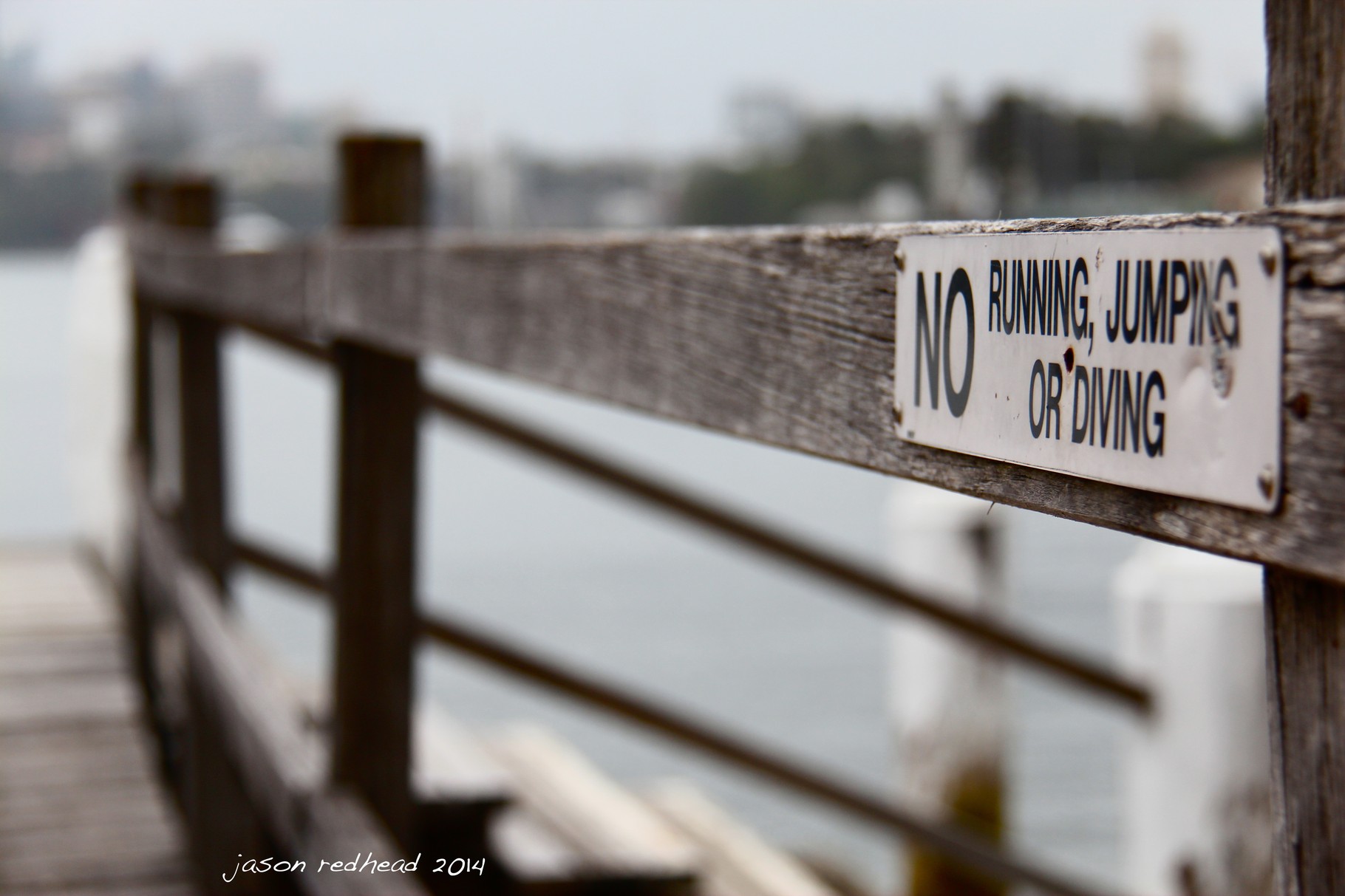  26-11-14 poor warning; they need to add falling and walking onto this sign. these are definitely ways to hurt yourself on this pier. mort bay, nsw