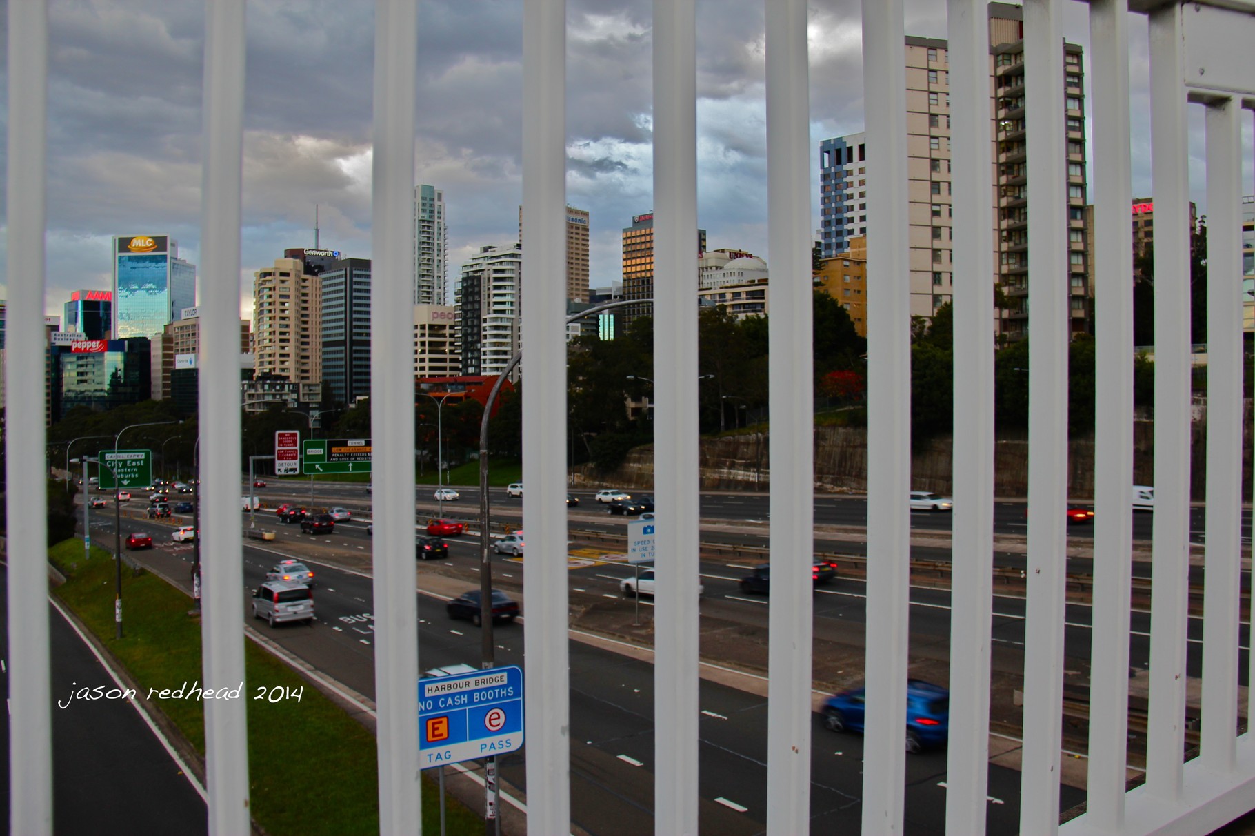  09-07-14 imprisoned; not even close to being in a prison because behind these bars is a stunning view of north sydney cbd. well maybe a prison if you were actually stuck in and amongst all these gigantic buildings. north sydney, nsw 